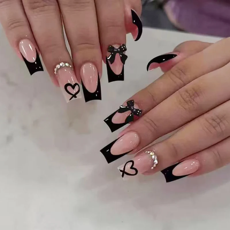 Dekorative lange Stiletto Press-On Nägel mit Herz- und Schleifen-Design