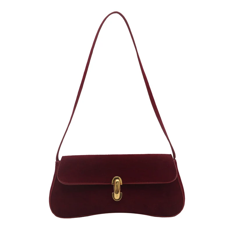 Elegante Wildleder-Handtasche mit verspieltem Schlüsselanhänger