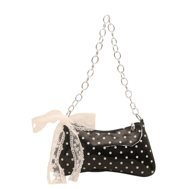 Charmante gepunktete Handtasche