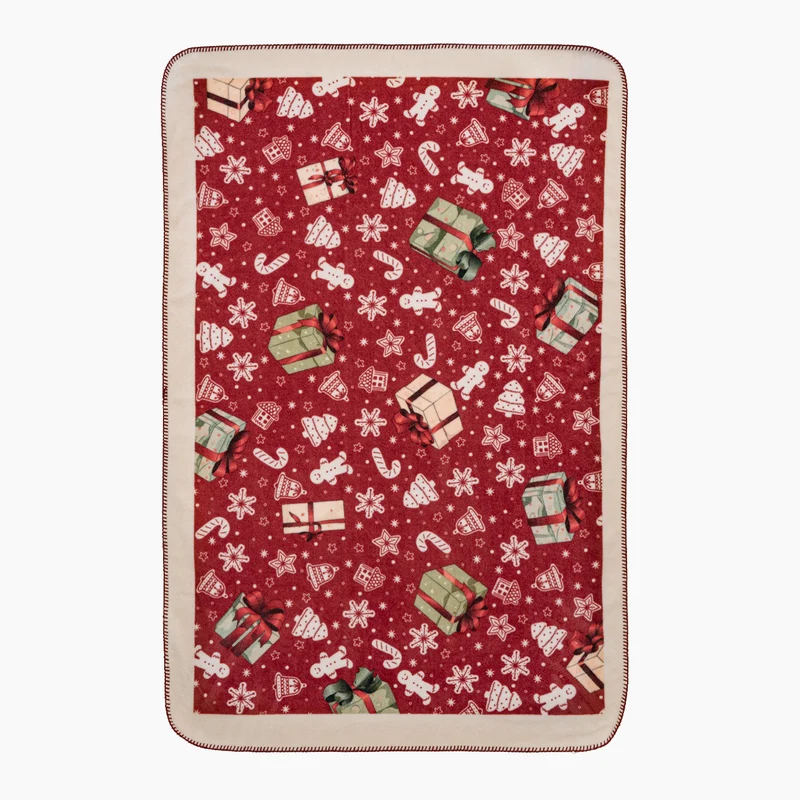 Weihnachtskuscheldecke mit Geschenk- und Lebkuchenmuster