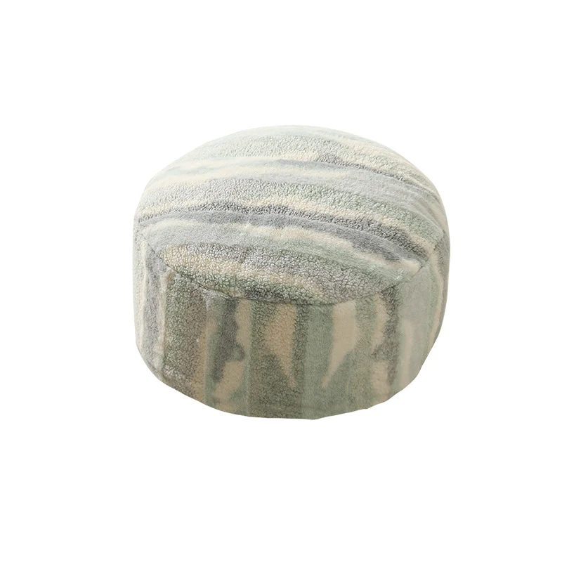 Rundes Sitzpouf aus Teddy‑Fleece mit weichem Strukturbezug