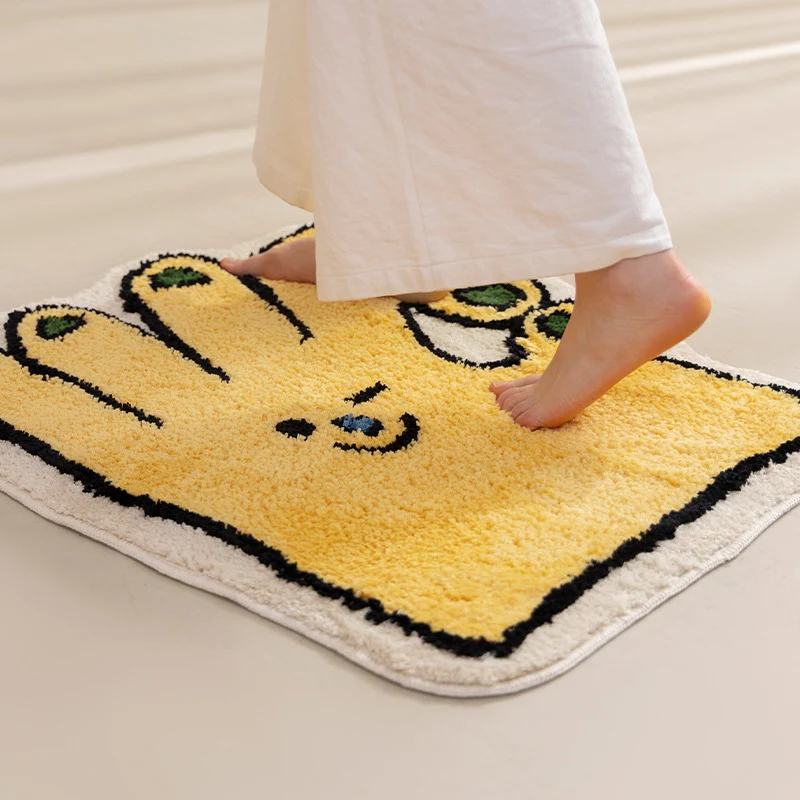 Geformter Badteppich in Handform mit tuftierter Chenille‑Textur und rutschfester Unterseite