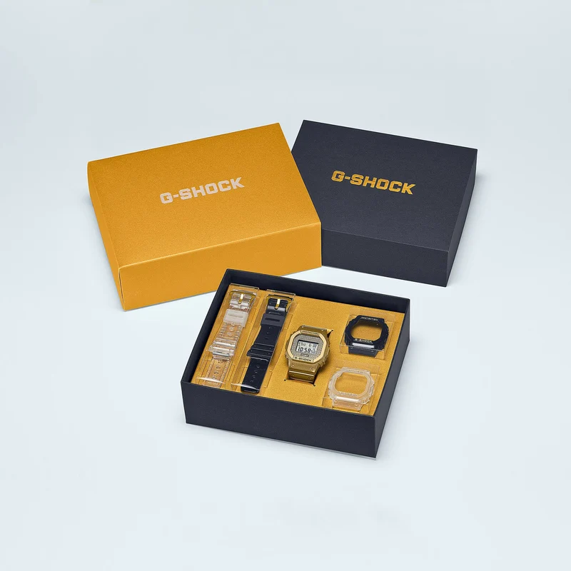 Casio G-Shock DWE-5600HG-1ER Herrenuhr Gold Chain Box Set • Wechselbare Lünetten und Bänder • Hip-Hop-Design