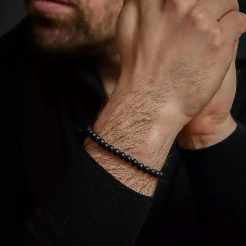 Armband aus 6mm schwarzen Naturstein mit schwarzem Edelstahlverschluss - Rebel&Rose Modell: RR-60089-B-L