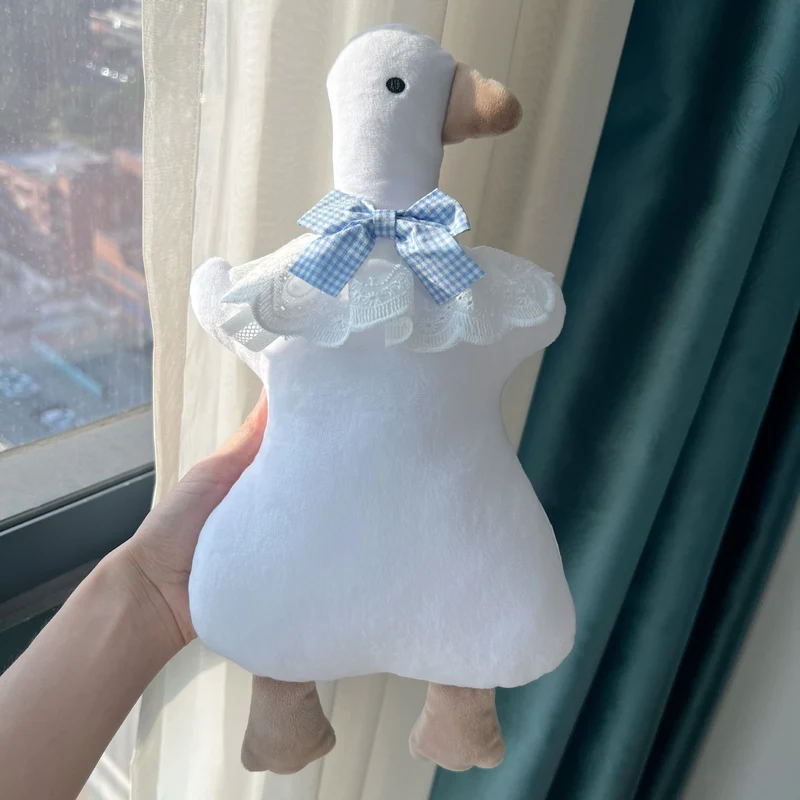 Plüsch-Ente Komfortkissen mit Gingham Schleife