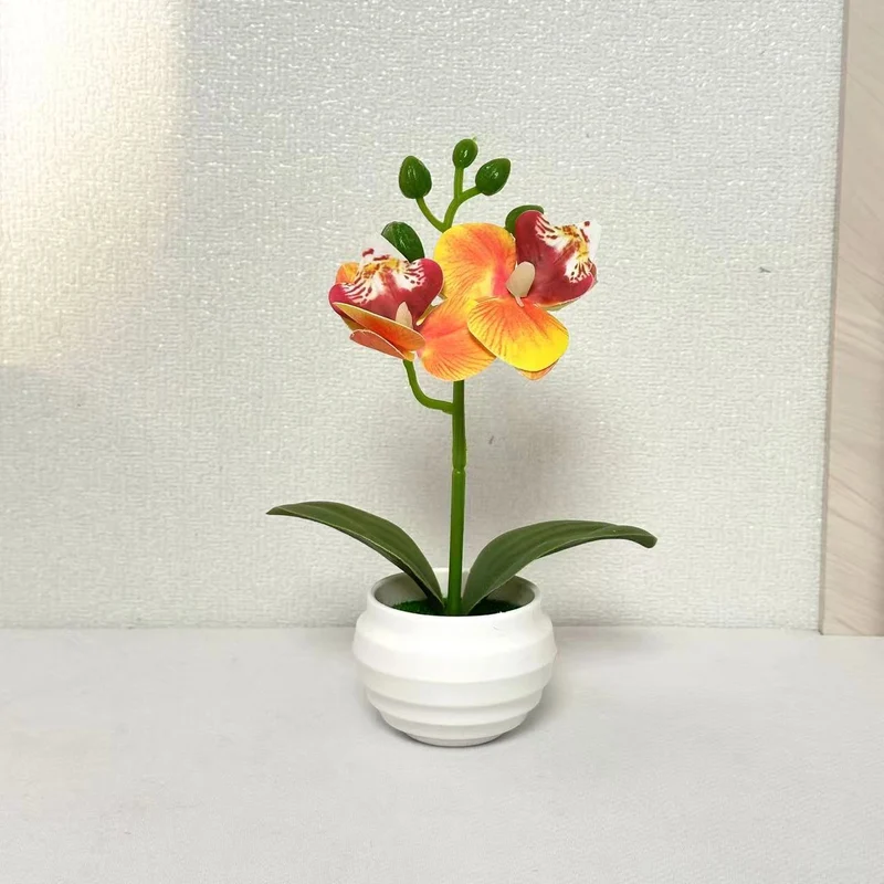 Lebensechte dekorative Orchideenpflanzenarrangement für die Wohnkultur
