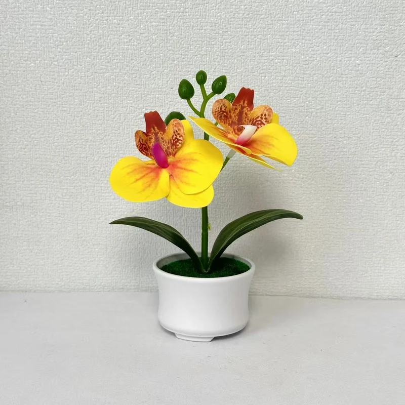 Elegante künstliche Orchideenpflanzenanordnung für die Innendekoration