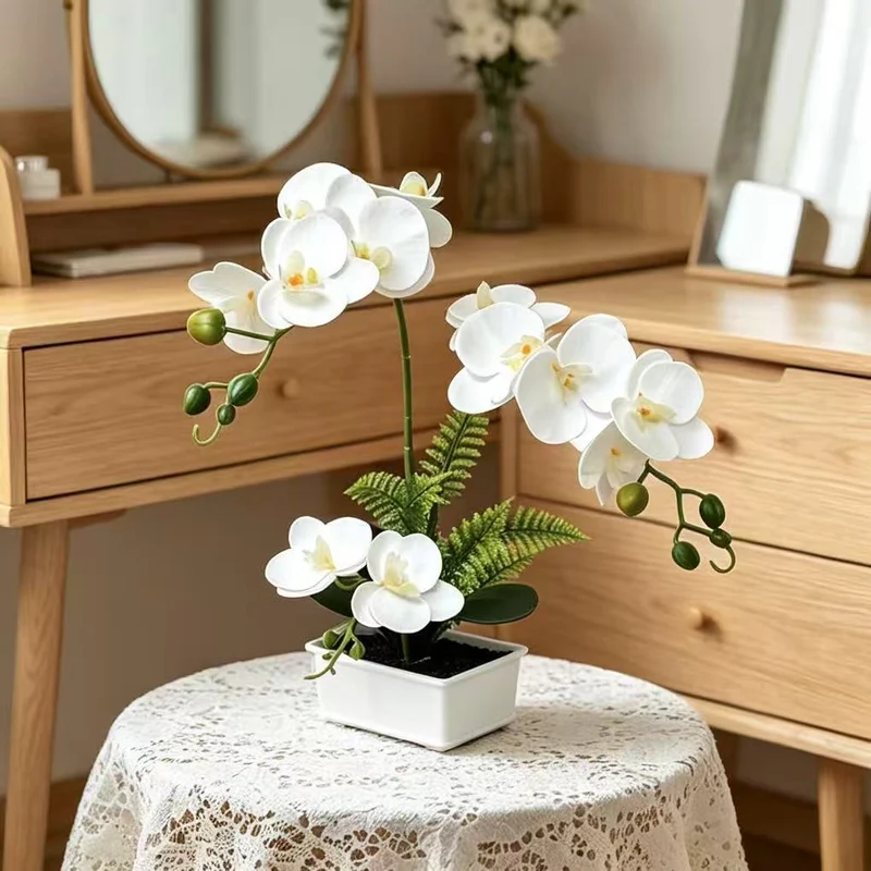 Elegante künstliche Orchideenarrangement für die Innendekoration