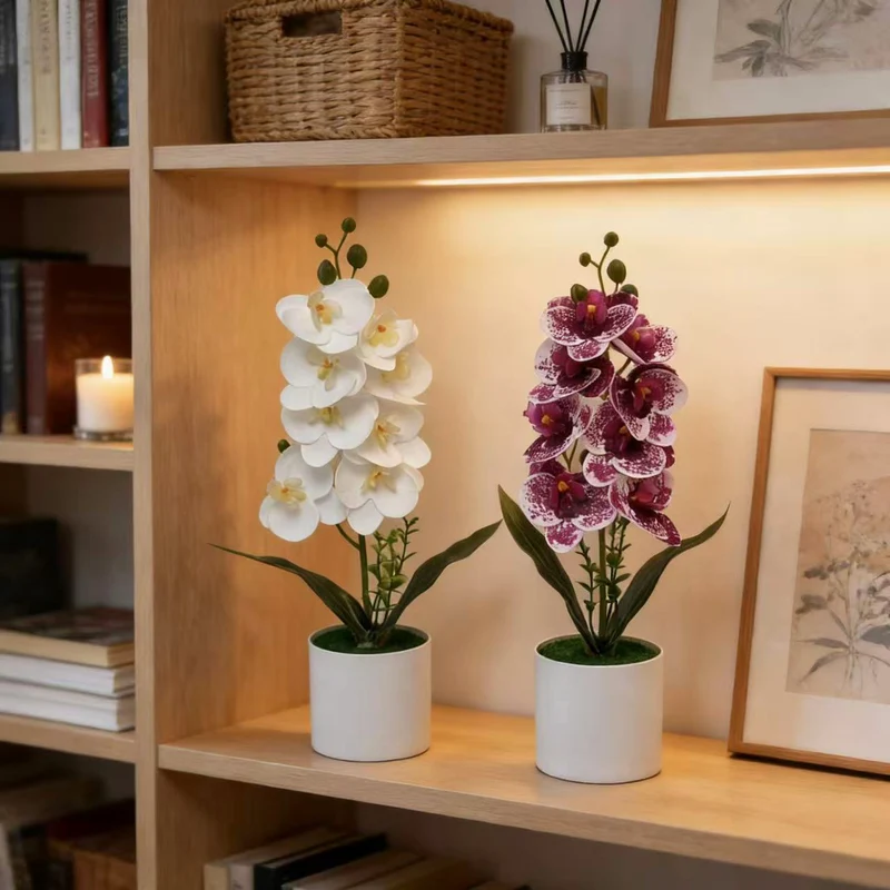 Dekorative künstliche Orchideenarrangement für Tischdeko